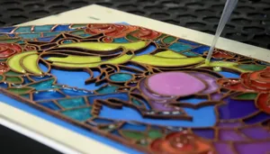 A stained glass design made via laser cutting and resin pouring.