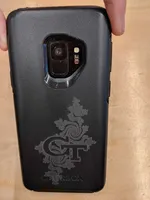 Phone case engraved with the letters GT