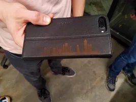 Phone case engraved with a skyline design